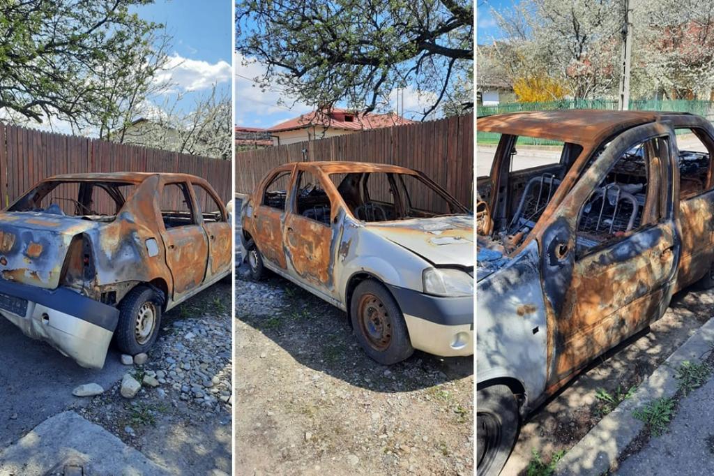 O mașină arsă a rămas abandonată pe domeniul public